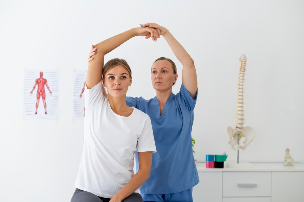 physiotherapist helping female patient her clinic 23 2149115564